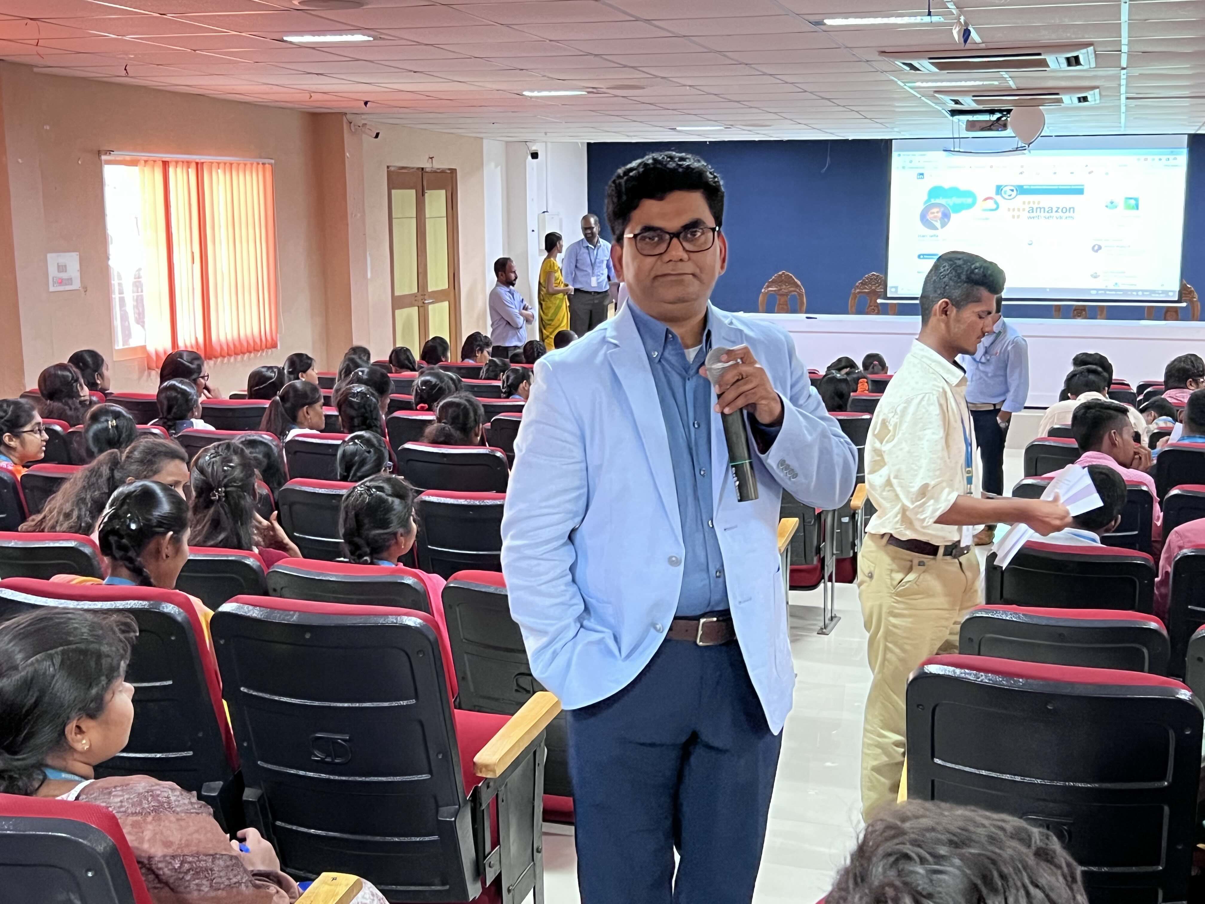 Students in discussion with the speaker after a session